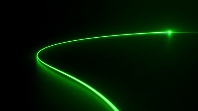 Glowing green laser beam curving through the dark