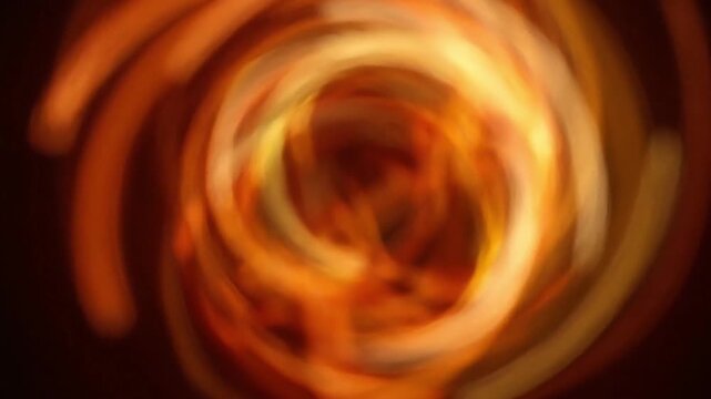 Abstract orange light trails swirling in a dynamic motion graphics background loop