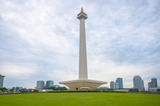 Jakarta, Indonesia - July 24, 2026: The National Monument (Monas) stands prominently in Merdeka Square with Jakarta's modern skyline in the background, documenting one of Indonesia's most iconic landm
