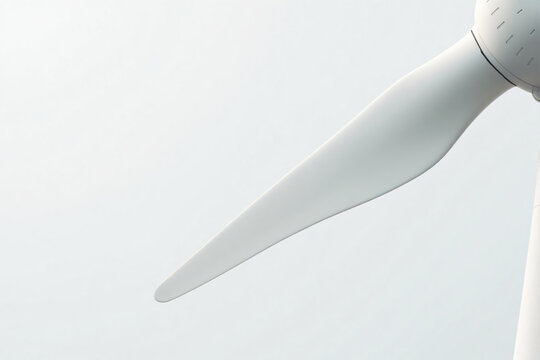 Close up of modern white wind turbine blade against cloudy sky for renewable sustainable energy production and clean technology