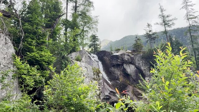 Hrebienok Waterfall in High Tatras Slovakia

Crystal-clear mountain waterfall flowing over granite boulders in Hrebienok, 
surrounded by alpine forest beneath the High Tatras, Slovakia, 20 July 2026.
