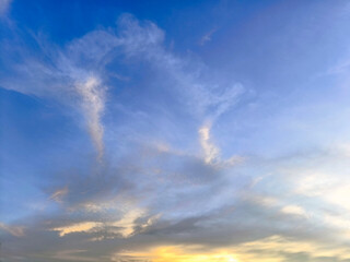 Fototapeta premium Colorful sunrise or sunset sky with clouds and warm light.