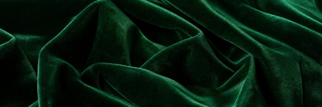 Dark green velvet fabric texture background