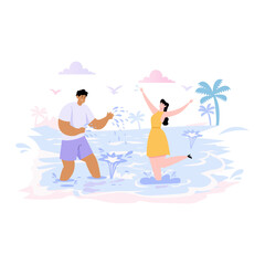 Fototapeta premium Couple splashing water at the beach.