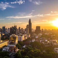 Fototapeta premium Aerial perspective showcases a densely populated urban setting illuminated by the warm light of a setting sun. Structures tower