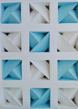 Abstract geometric concrete roster pattern background with white and blue colors."