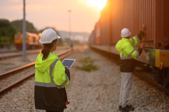 Workers are inspecting the condition of containers ready for shipment abroad.