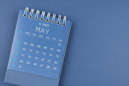 May 2027 calendar on blue color background. Desk calendar for planning.