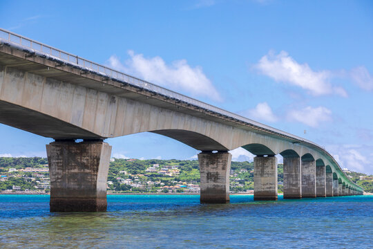 The Kouri Bridge in Okinawa spans the blue sea, connecting Kouri Island.