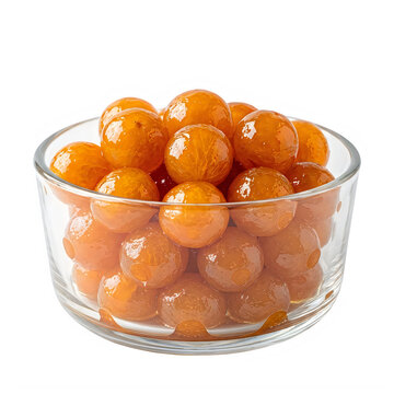 Fresh orange kumquat fruits in a clear glass bowl