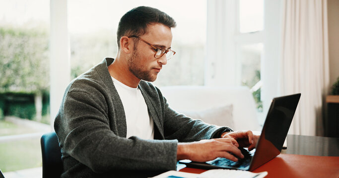 Remote work, man and typing on laptop in home for financial reporting, external audit and taxes. Freelancer, accountant and research with tech in house for company bookkeeping, data entry and payroll