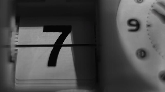 Black and White Close Up View of Date Number Display on Vintage Flip Clock