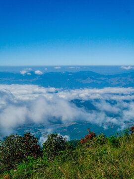 Vertical Amazing Landscape mountain green field meadow white cloud blue sky sunrise. Vertical Beautiful Mountain landscape foggy windy mountain range green landscape asian farm. Countryside scenery