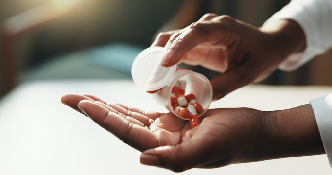 Medical, healing and hand in house with pills, care plan and health treatment with medication. Healthcare, cure or woman with drugs, capsule option or recovery prescription in pharmaceutical solution