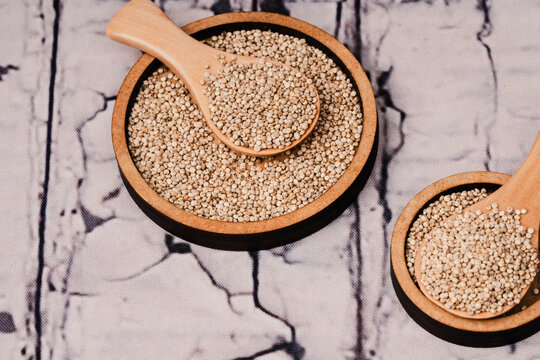 Chenopodium quinoa - Organic white quinoa seeds in bowl and spoon