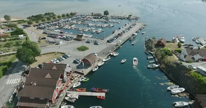 Aerial view of coastal marina and residential area in H&oslash;llen Norway