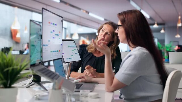 Woman Working On Laptop To Improve Business Workflow