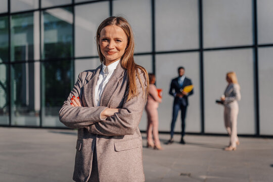 Businesswoman looking confident with arms crossed outdoors