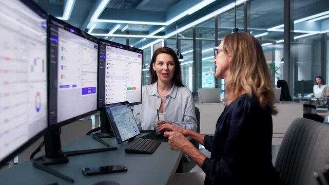 Sales Manager Studies Sales Dashboard On Computer