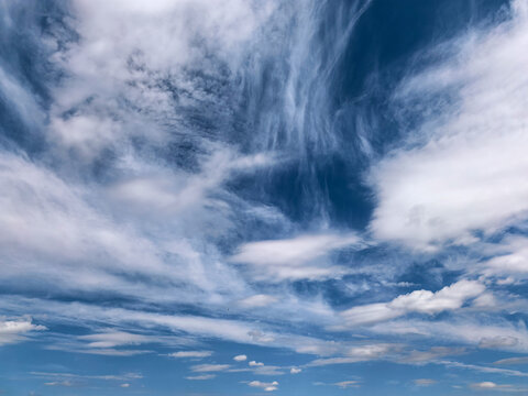 Wispy Cirrus Clouds Over Bright Blue Sky