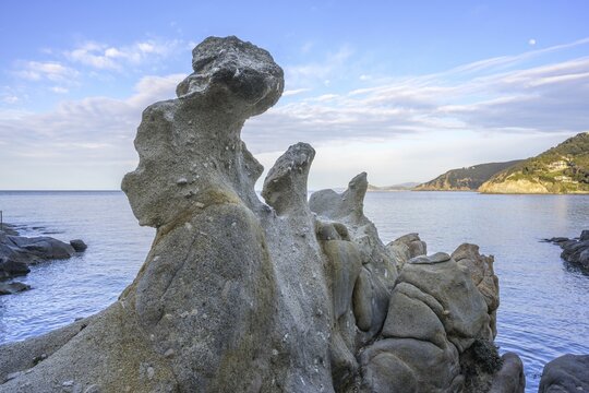 Road along the coast with beautiful rock formations to, Capo Sant Andrea, Marciana, Livorno Province, Italy