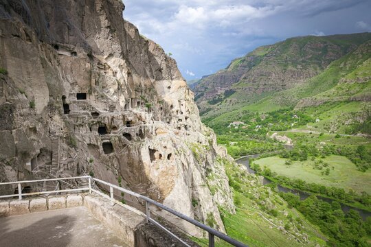 Panoramic viewpoint of VArdzia city caves with green canyon in background. Georgia