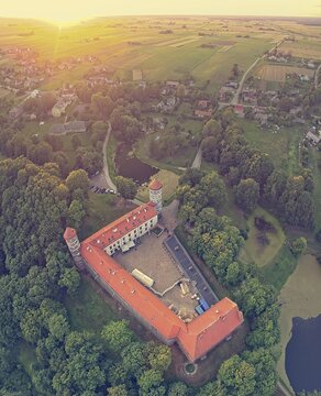 Aerial vertical panoramic view to historical Panemune castle and lithuanian countryside during the sunset. Vintage aerial Background. Panemune. Lithuania