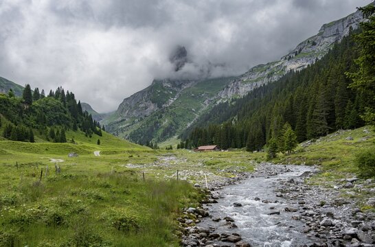 Bach Sousbach in a mountain valley, cloudy mountain landscape, Bernese Alps, Bernese Oberland, Switzerland
