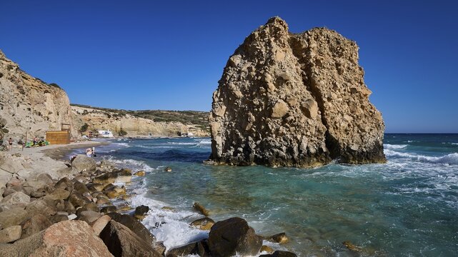 Large rock formation on a beach with turquoise sea and burning waves, Firiplaka beach, Milos island, volcanic island, Cyclades, Greek Islands, Greece