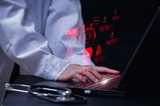 Frustrated doctor facing critical ai system failure on modern laptop computer showing red warning hologram beside stethoscope on desk