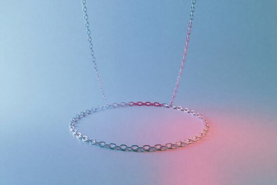 Hanging oval closed silver metal chain with one section of red links on soft blue to pink gradient background shows connection network and weak point concept