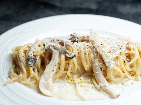 Pasta with mushrooms and cheese on a plate