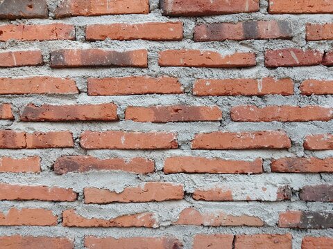 Red Brick Wall Texture Background with Cement Mortar Pattern for Construction and Architecture