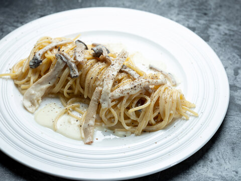 Pasta with mushrooms and cheese on a plate