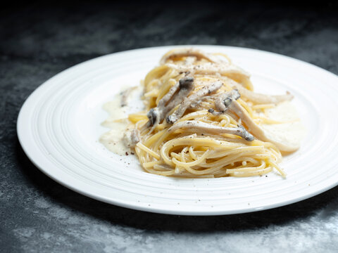Pasta with mushrooms and cheese on a plate