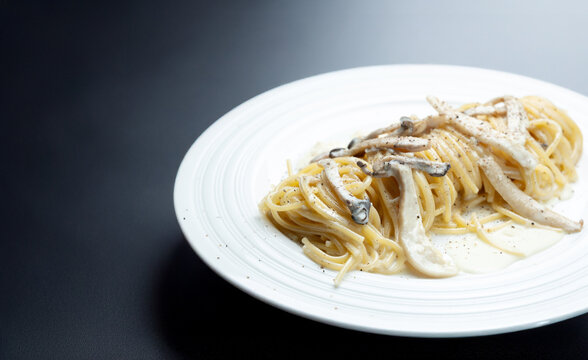 Pasta with mushrooms and cheese on a plate