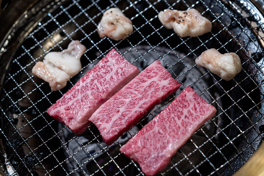 Raw Wagyu Beef and Beef Intestine on Japanese Yakiniku Grill