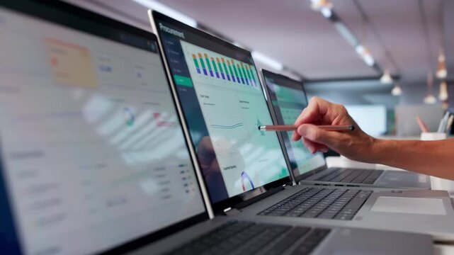 Mature Woman Reviews Supplier Contracts On Laptop