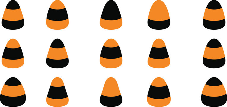 A collection of various orange and black candy corn pieces arranged in a grid pattern for halloween holiday designs