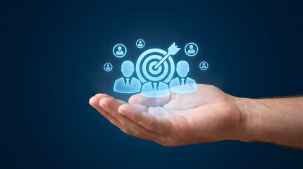 Fototapeta premium Hand holding glowing target with business people icons, target audience and customer focus, Digital human resources and team management concept.