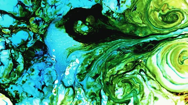 Fluid paint mixing in vibrant shades of green and bright azure blue