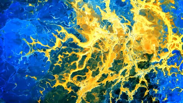 Blue and yellow liquid pigments combine to create vibrant patterns