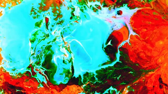 Vibrant turquoise and red liquid paint mixing in artistic motion