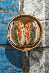 Sushi burger on road markings. Delivery box. Art photo. © Cavan
