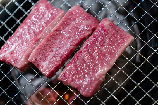 Raw Hida Wagyu Beef on Charcoal Grill Before Cooking
