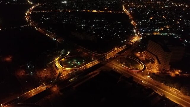 A breathtaking birds eye view of Kano road networks at night reveals illuminated highways moving traffic and the dynamic growth of a modern urban center.