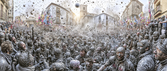 Naklejka premium Crowds covered in black paint during the Cascamorras festival in Baza