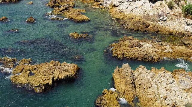 Busan South Korea Rocky Coastline Ocean Waves Crashing Overhead Shot