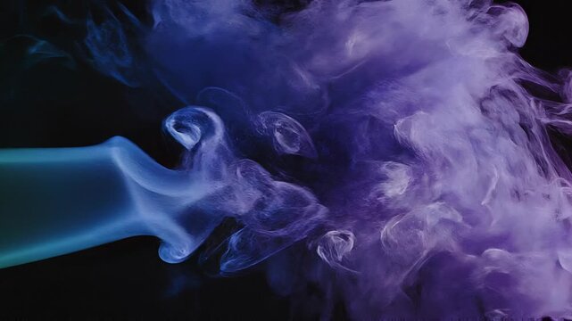 Colorful visual effect abstract rainbow gas smoke waves concept. Blue smoke swirling from a green vape pen on black background with detailed vapor patterns