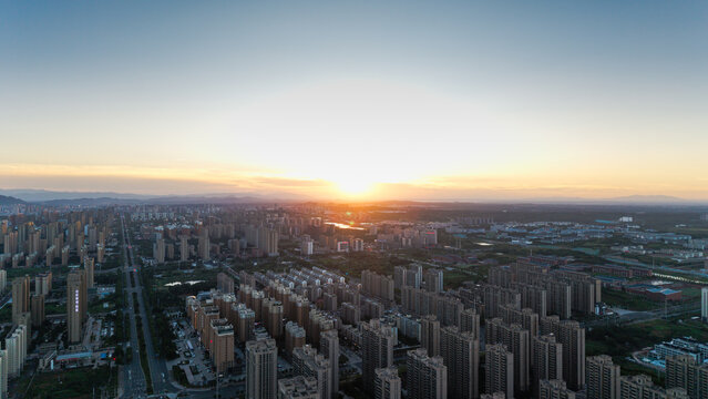 Urban skyline at sunset with dense high-rise buildings and panoramic city view